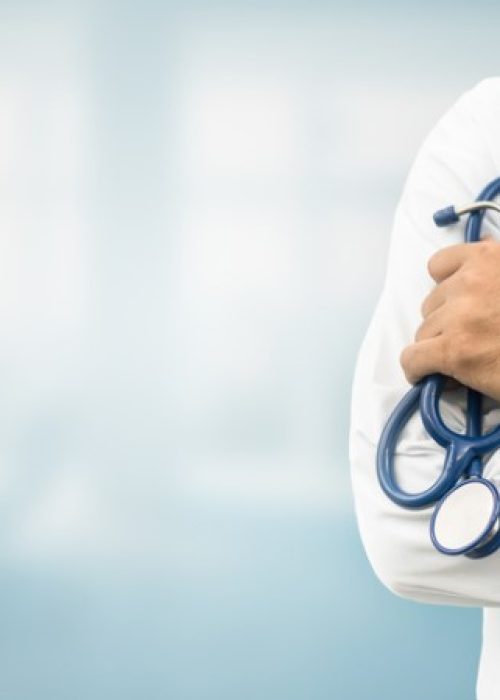 Doctor in hospital background with copy space. Healthcare and medical concept.